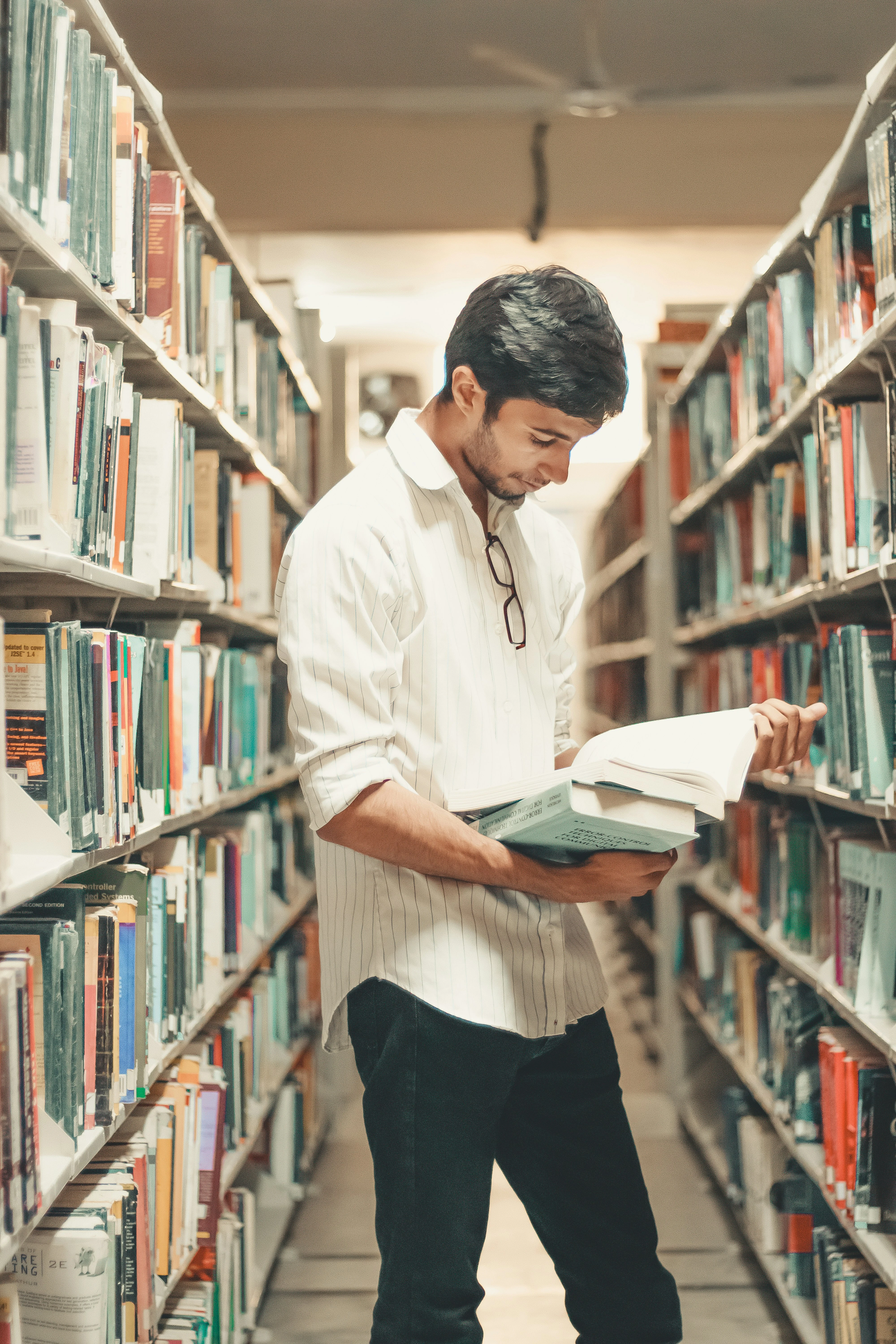 Student reading in library